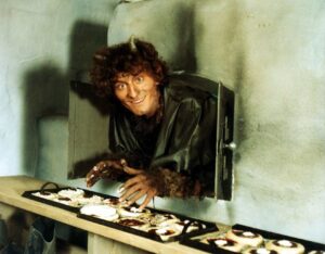 A person in a furry werewolf costume leans out of an oven vent, reaching for donuts on a pastry belt.